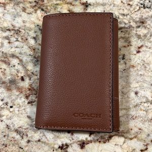 Men’s brand new Coach wallet . Never used!